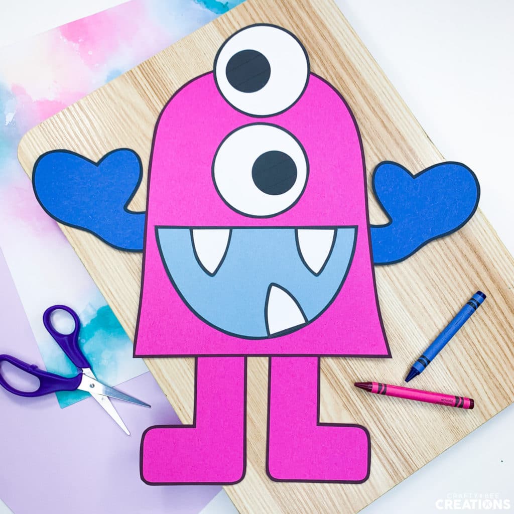 Pink monster craft with two eyes and pointy teeth!