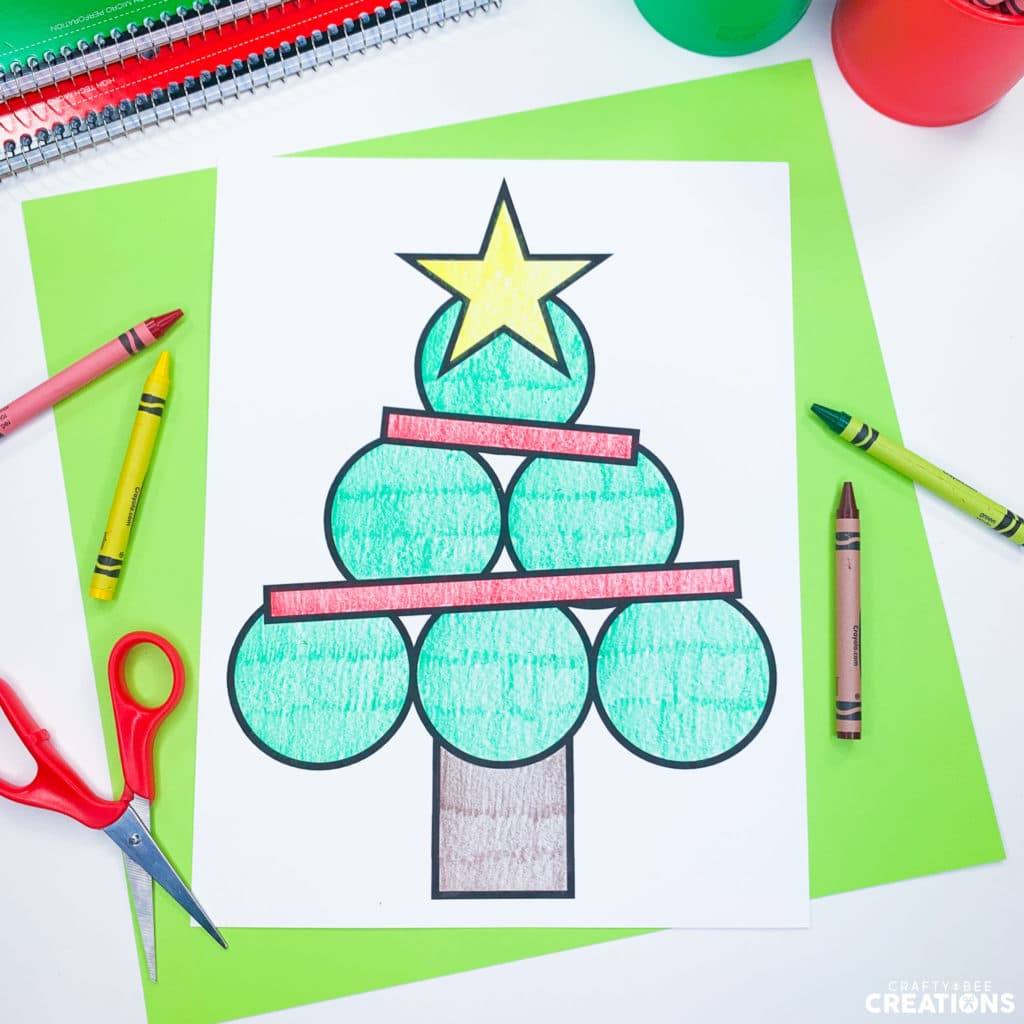 Christmas Tree Shape Craft shown colored in with crayons.